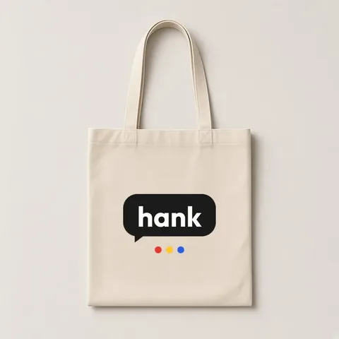 A natural cotton tote bag with a hank logo printed on the front